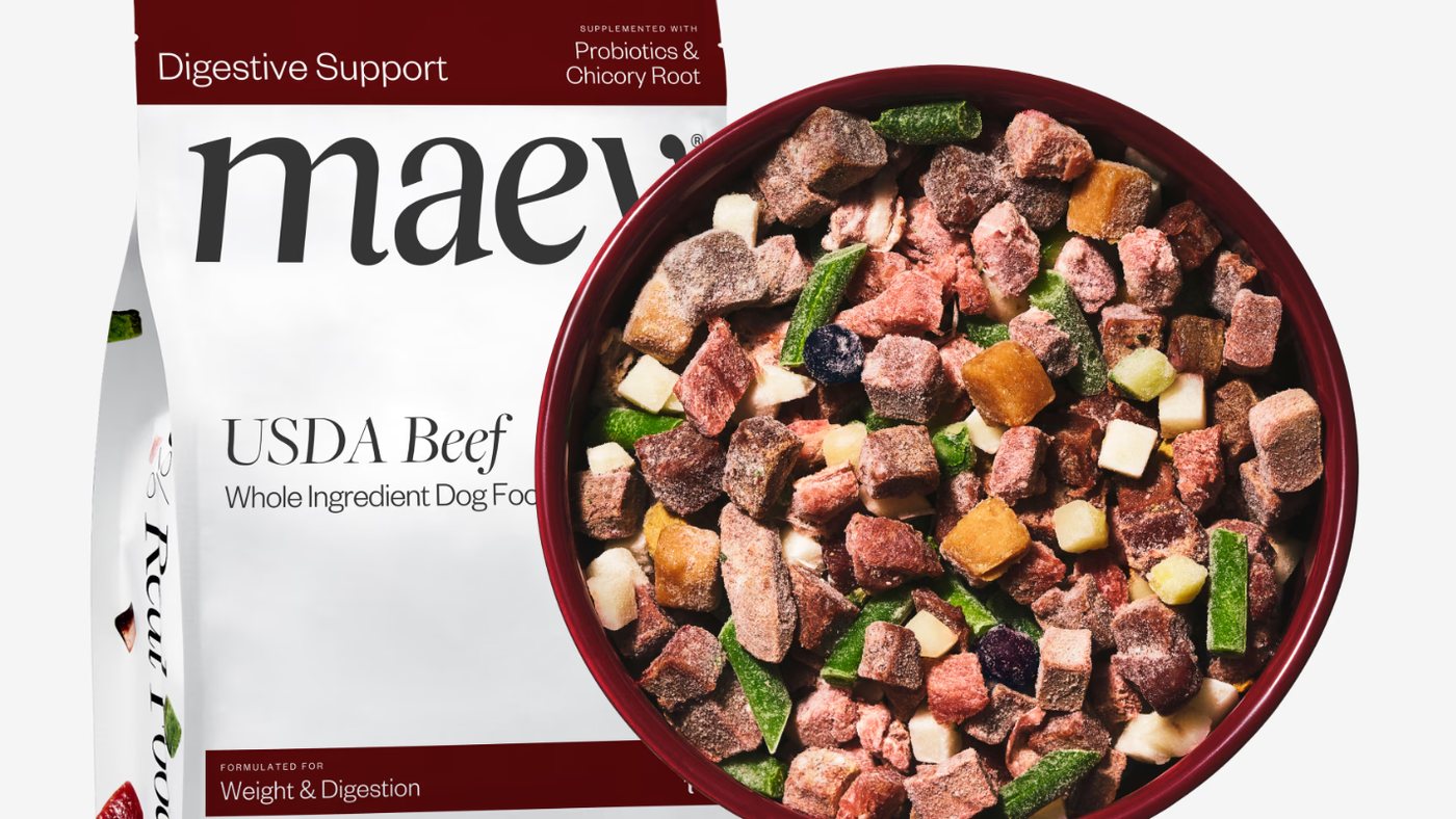 Maev USDA Beef bag beside a bowl of Maev's raw, whole-ingredient dog food